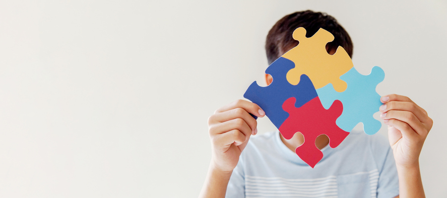 a person holding puzzle pieces