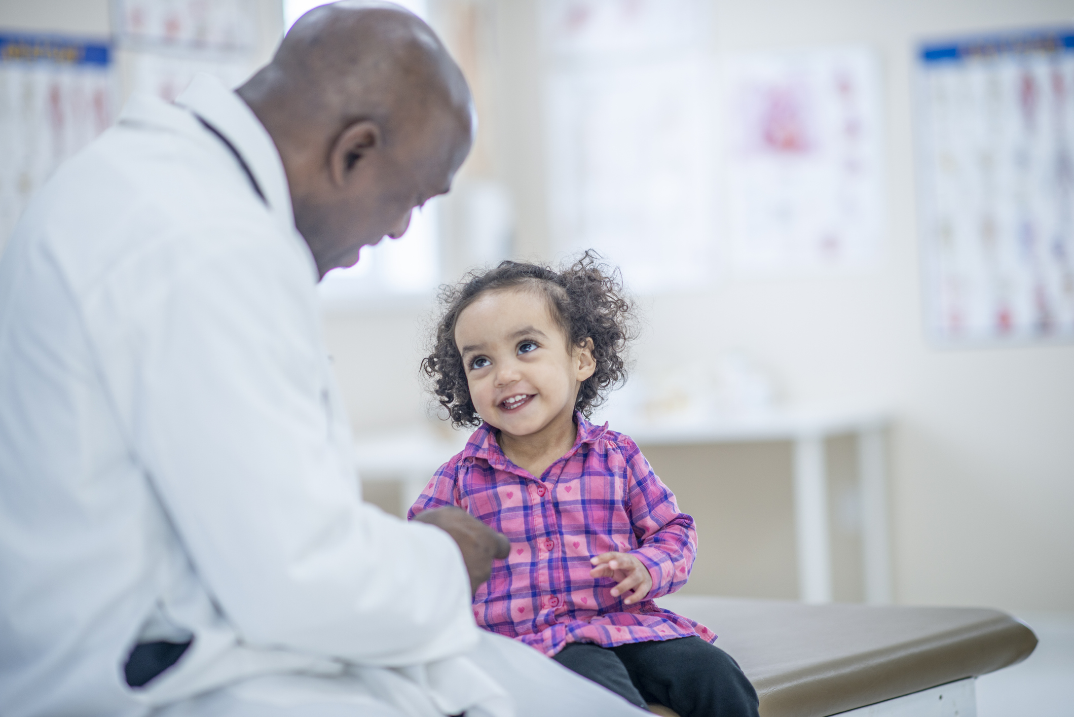 Physician with young girl
