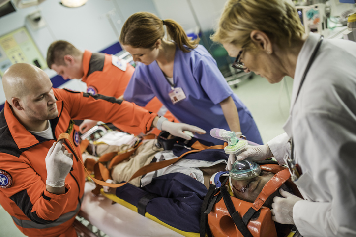 nurses checking a patient in a stretcher