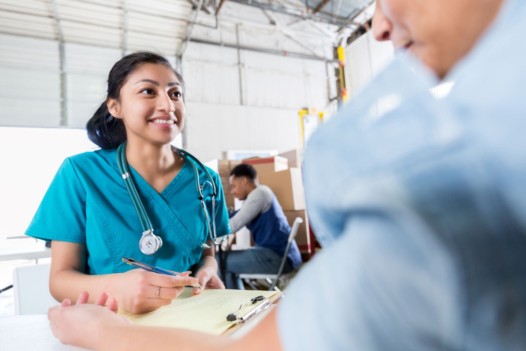 Nurse talking with employee about health issues image
