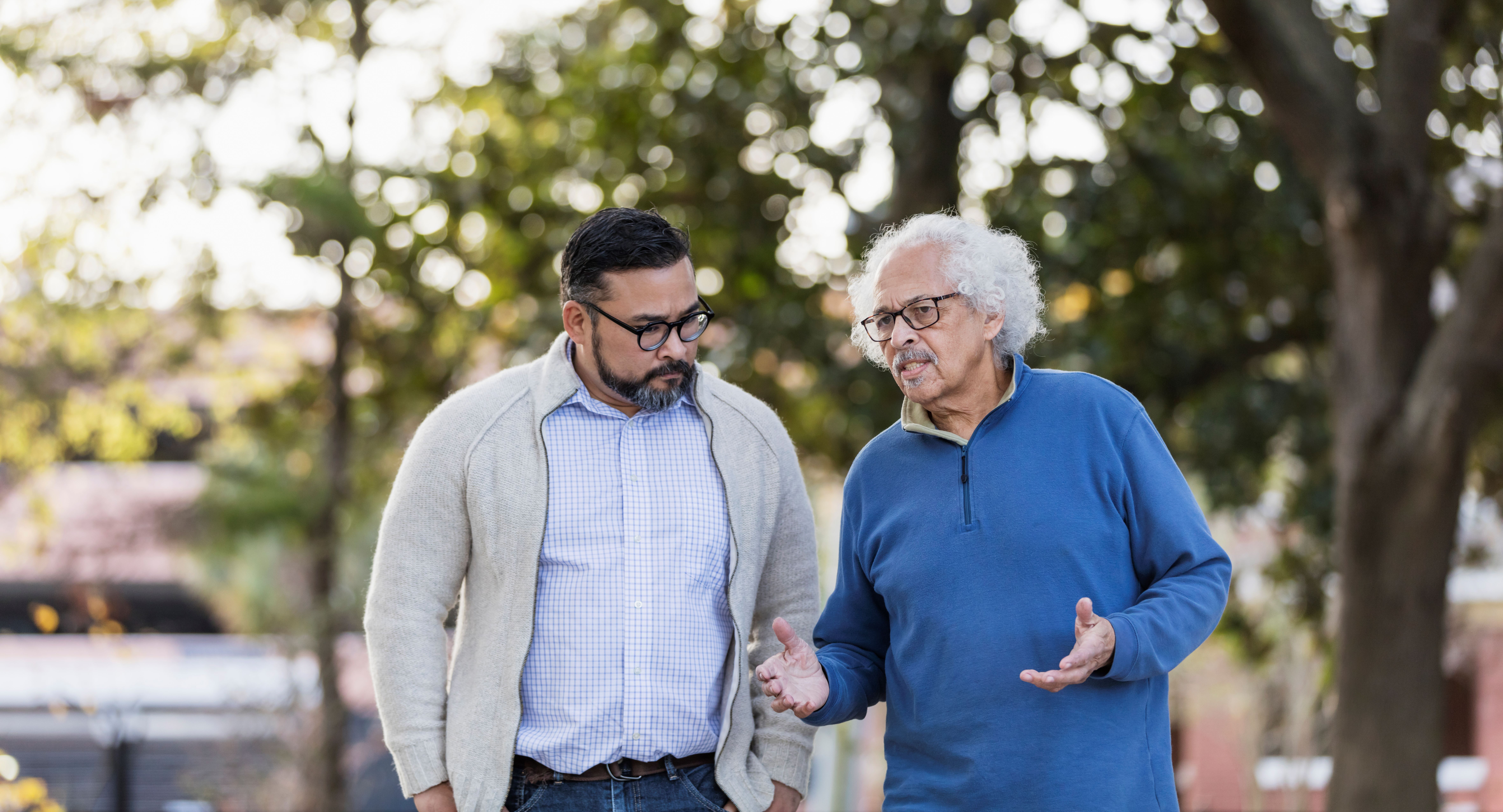 Father and son having a discussion outdoors